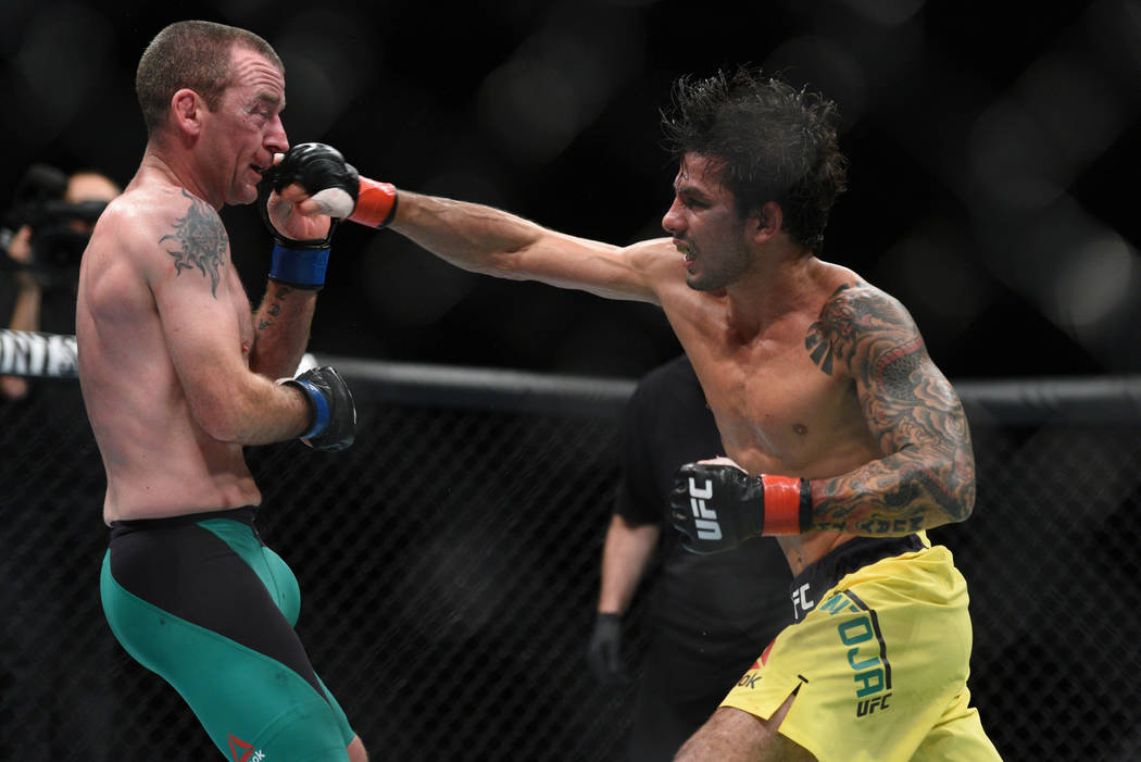 Alexandre Pantoja (red gloves) fights Neil Seery (blue gloves) during UFC Fight Night on July 16 in Glasgow, Scotland. (Per Haljestam-USA TODAY Sports)