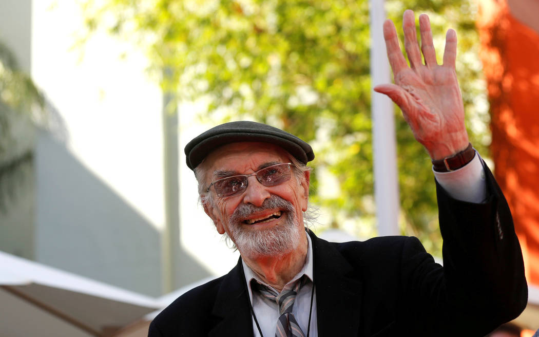 FILE PHOTO -  Actor Martin Landau waves at a ceremony for director Tim Burton to place his handprints and footprints in cement in the forecourt of the TCL Chinese theatre in Hollywood, California  ...