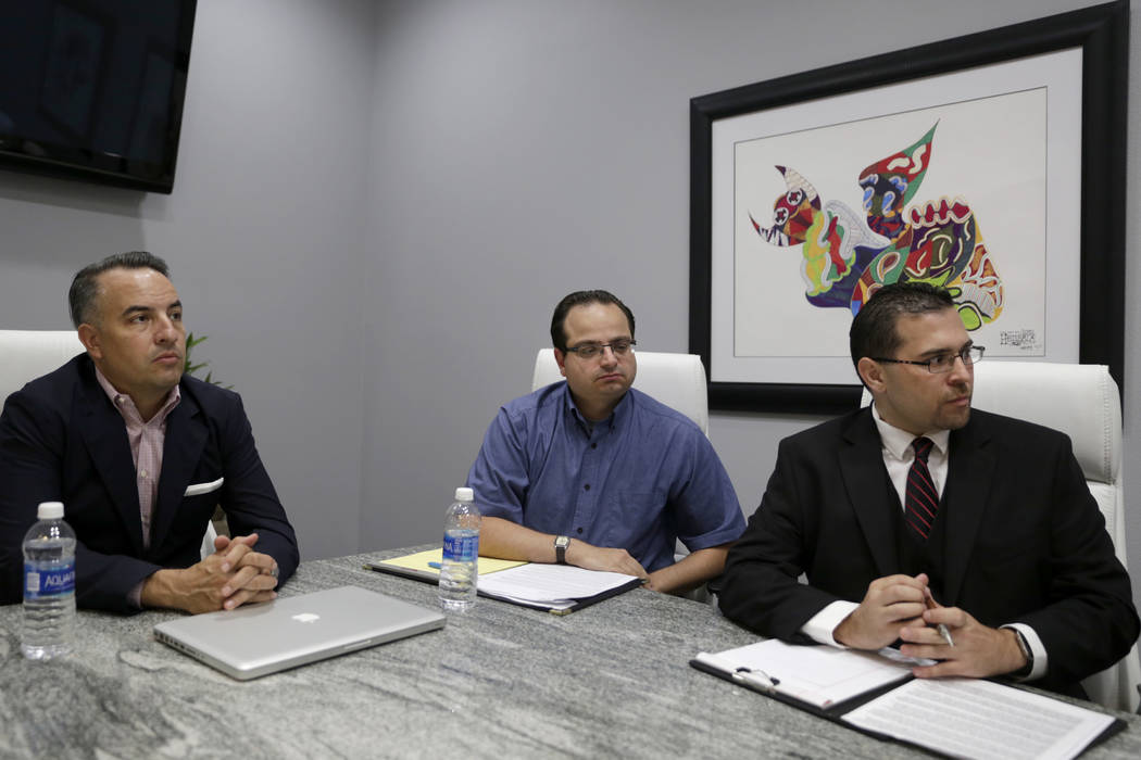 Attorney Andre Lagomarsino, left, meets with former officers of the Teachers Health Trust, who were terminated or left, executive assistant Michael Ielpi, center, and Director of Operations Philip ...