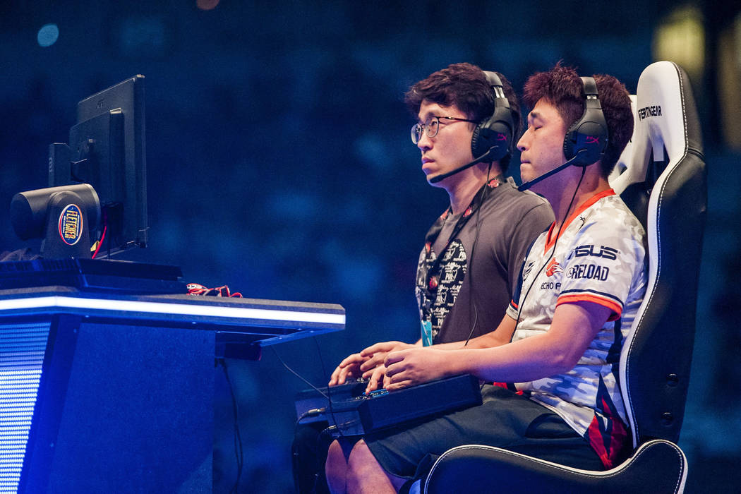 Jae Min Bae aka &quot;Knee&quot;, right, and Choi Jin Woo aka &quot;Saint&quot;  face off in Tekken 7 during the Evo 2017 Championship Series, a fighting game tournament, at the Ma ...