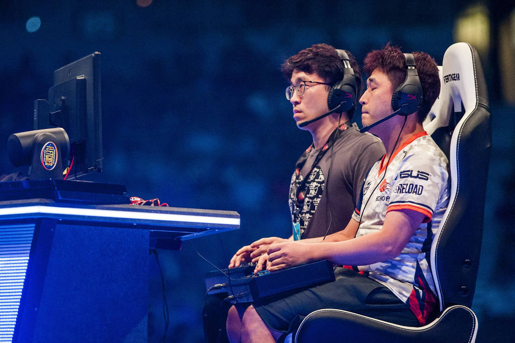 Jae Min Bae aka "Knee", right, and Choi Jin Woo aka "Saint" face off in Tekken 7 during the Evo 2017 Championship Series, a fighting game tournament, at the Ma ...