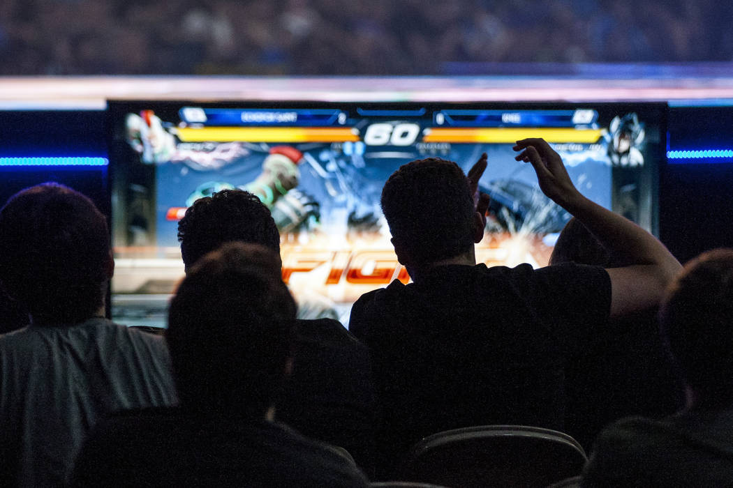 Spectators cheer as a fight begins in a round of Tekken 7 during the Evo 2017 Championship Series, a fighting game tournament, at the Mandalay Bay Events Center on Sunday, July 16, 2017. Patrick ...