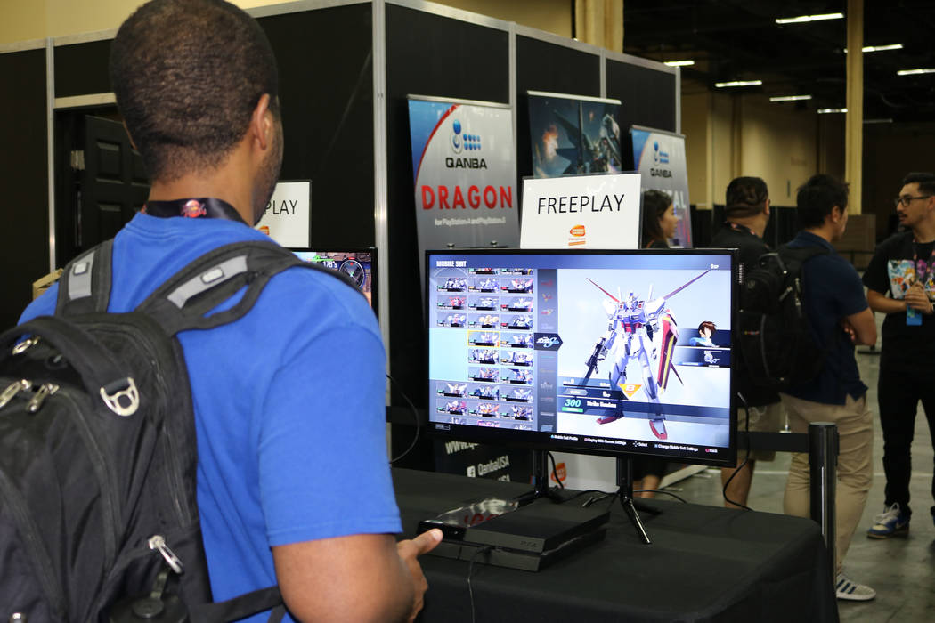 Omar Gates, 25, tries out video game "Gundam Versus", released July 6, 2017 at the 2017 Evolution Championship Series Friday, July 14, 2017 at Mandalay Bay. "Money matches are good, but it's bette ...