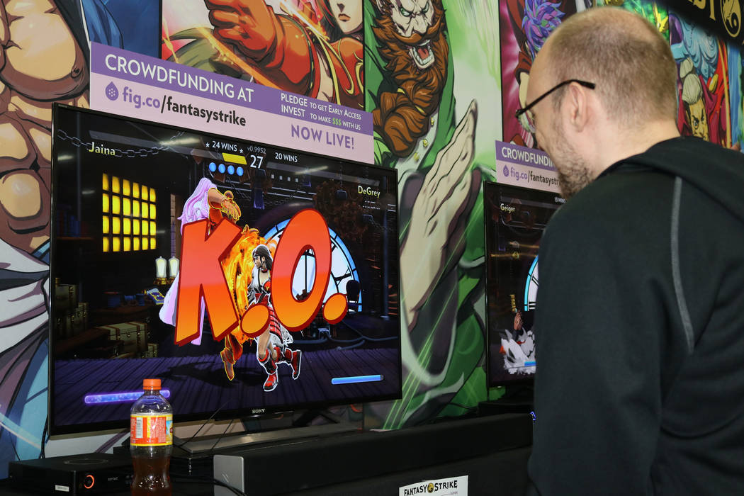 Robert Burke, 27, jokes that he is getting his butt kicked in "Fantasy Strike", a video game still in development, at the 2017 Evolution Championship Series Friday, July 14, 2017 at Mandalay Bay. ...