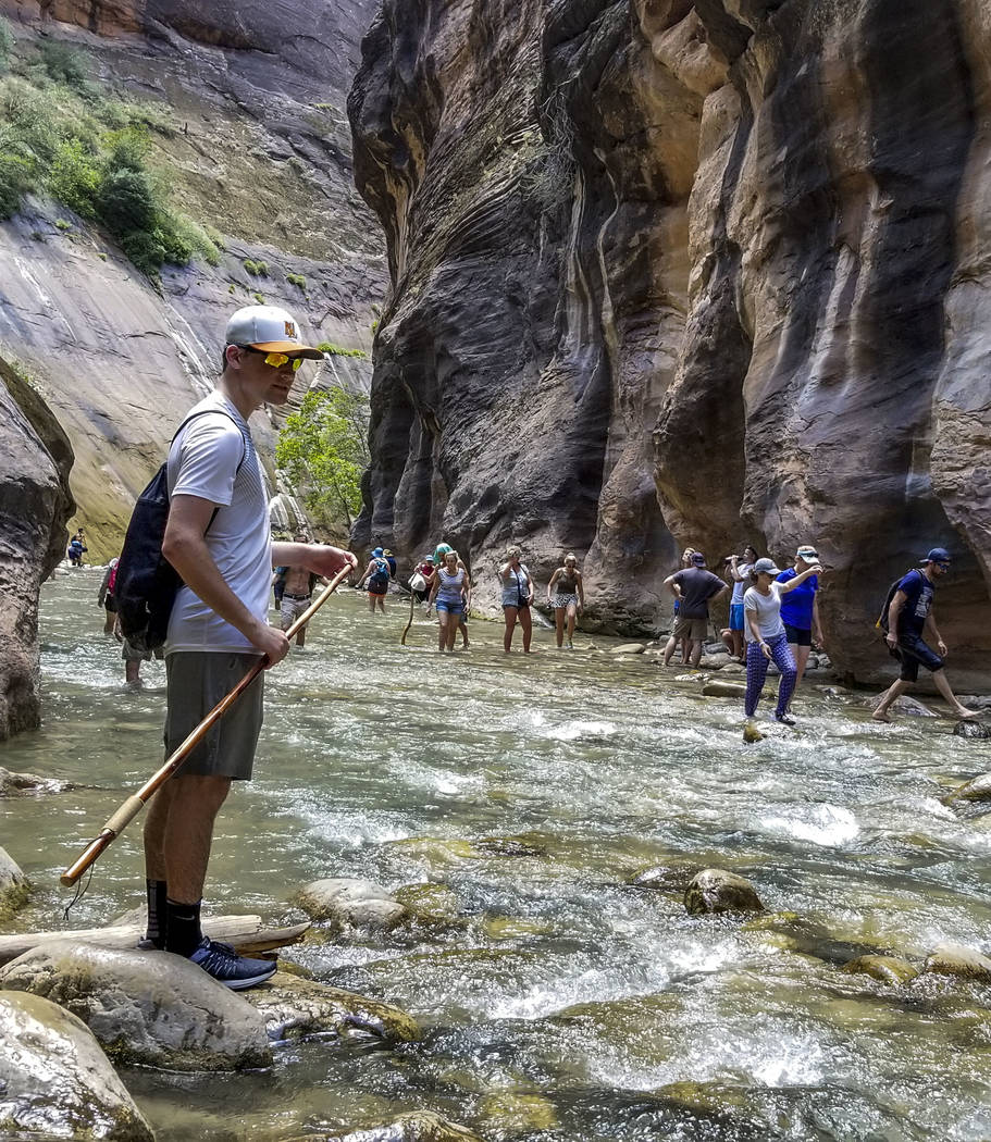 Zion National Park visitors walk along The Narrows, a river hike through the Virgin River, at Zion National Park in Utah on Friday, July 14, 2017.  Patrick Connolly Las Vegas Review-Journal @PConnPie
