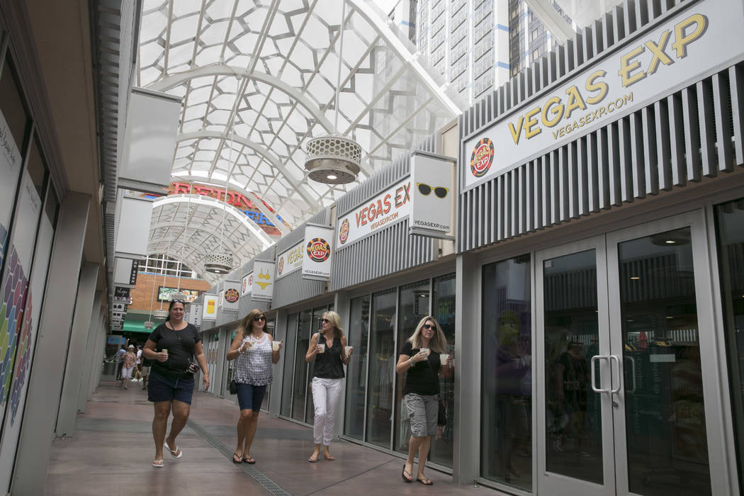 People walk by the front of Vegas EXP store in the Grand Bazaar Shops on the Strip in Las Vegas, Thursday, July 20, 2017. Vegas EXP will be the first interactive digital store in Las Vegas. (Gabri ...