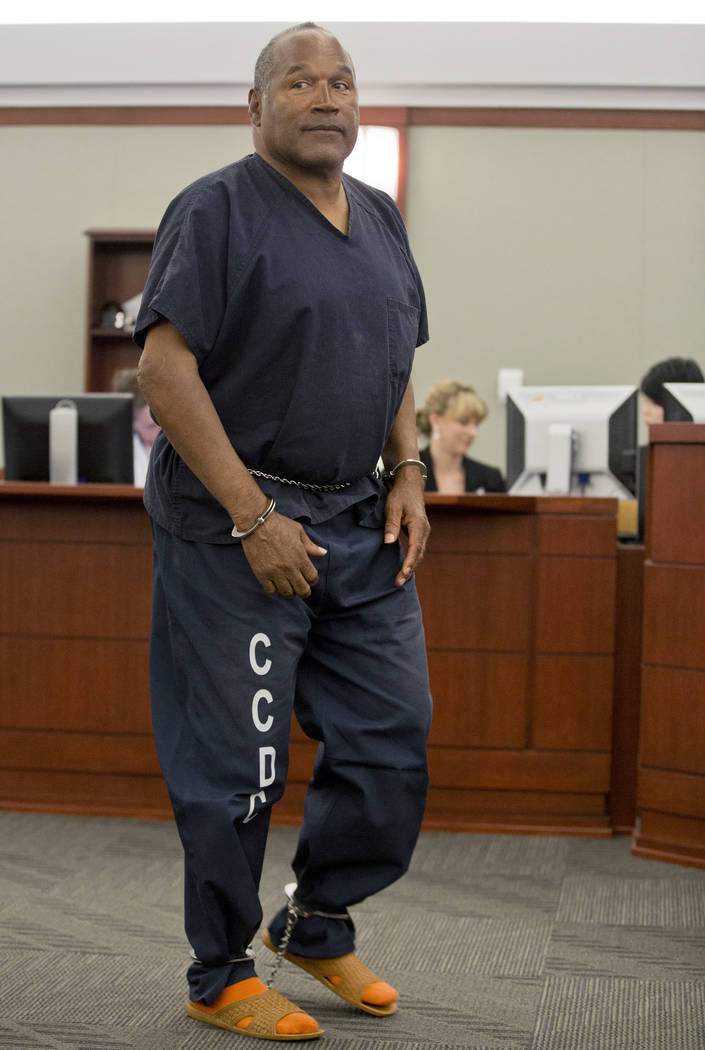 O.J. Simpson returns to the witness stand to testify after a break during an evidentiary hearing in Clark County District Court in Las Vegas on May 15, 2013. (Julie Jacobson/AP, Pool, file)