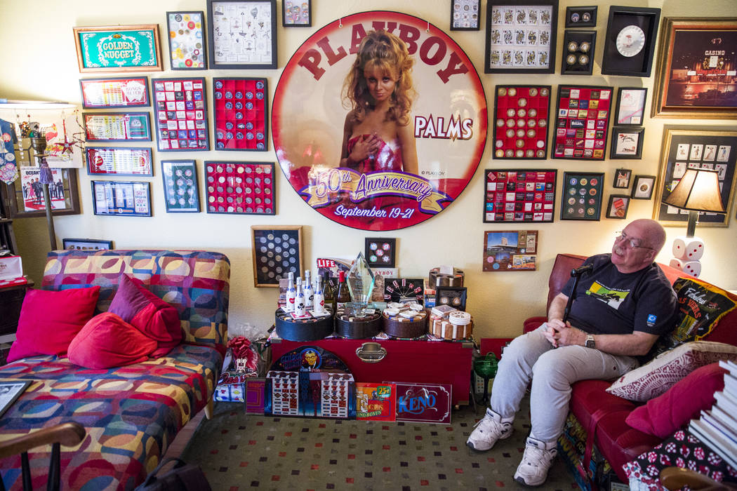 Sheldon Smith sits among his casino collection in his living room. (Todd Prince/Las Vegas Review-Journal)