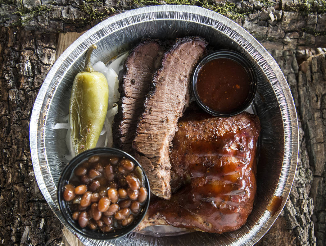 The two meat plate with brisket, chicken and baked beans at Sin City Smokers on Wednesday, July 19, 2017, in Henderson. Benjamin Hager Las Vegas Review-Journal @benjaminhphoto