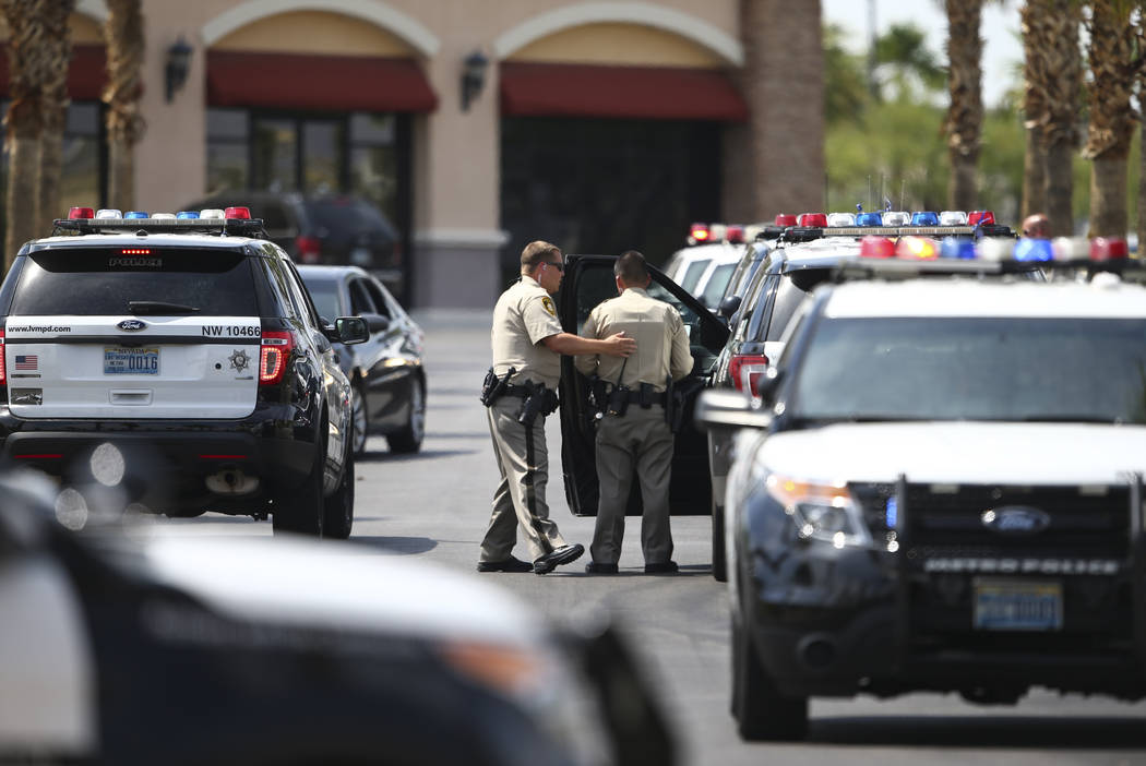 Las Vegas police investigate the scene of an officer-involved shooting in a shopping center at the 6700 block of North Durango Drive in Las Vegas on Tuesday, July 18, 2017. Chase Stevens Las Vegas ...