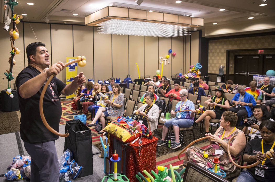 Fabrizio Bolzoni, left, leads a balloon art class during the Bling Bling Jam Balloon Convention on Tuesday, July 25, 2017, at the Golden Nugget hotel-casino, in Las Vegas. Benjamin Hager Las Vegas ...