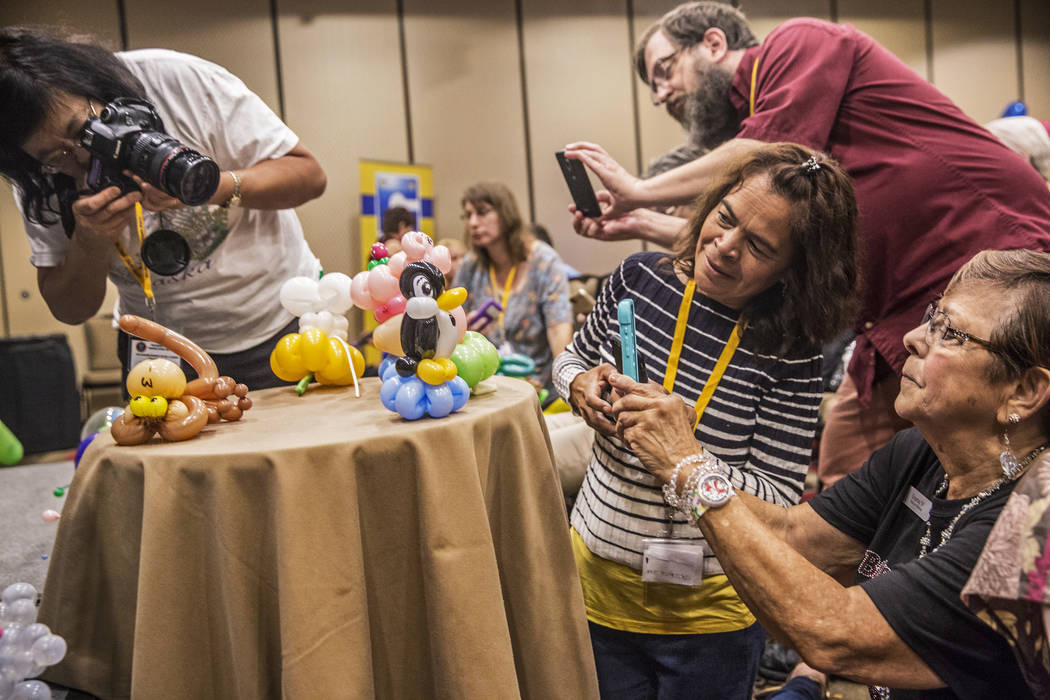Convention attendees take photos of balloon art during the Bling Bling Jam Balloon Convention on Tuesday, July 25, 2017, at the Golden Nugget hotel-casino, in Las Vegas. Benjamin Hager Las Vegas R ...