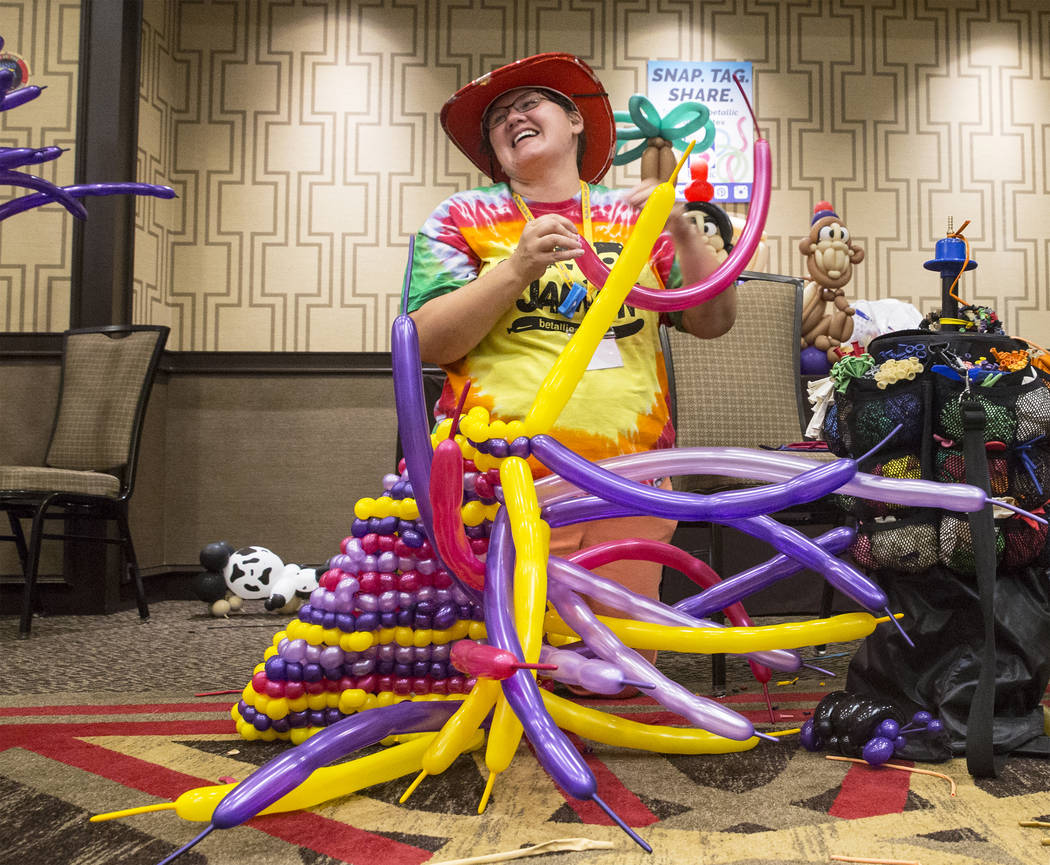 Diana Root works on the magic carpet for an Aladin float during the Bling Bling Jam Balloon Convention on Tuesday, July 25, 2017, at the Golden Nugget hotel-casino, in Las Vegas. Benjamin Hager La ...