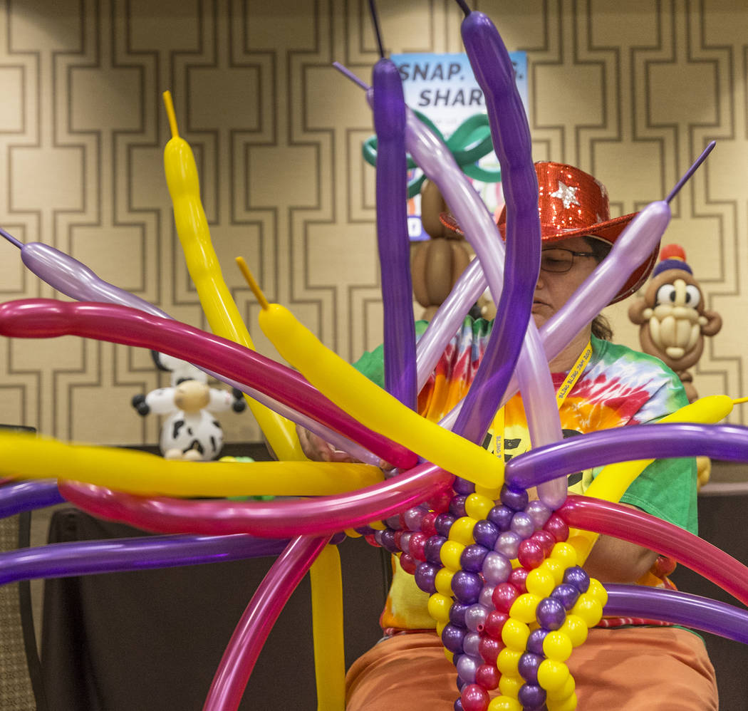 Diana Root works on the magic carpet for an Aladin float during the Bling Bling Jam Balloon Convention on Tuesday, July 25, 2017, at the Golden Nugget hotel-casino, in Las Vegas. Benjamin Hager La ...