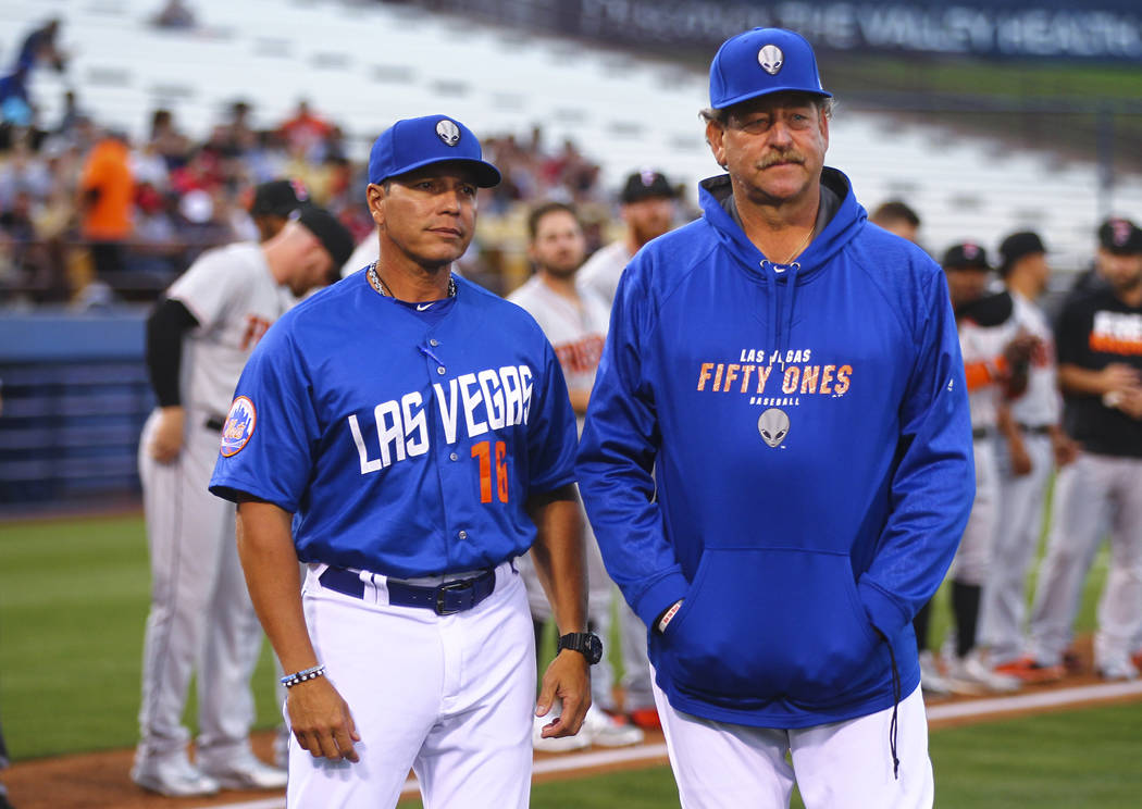 Las Vegas 51s manager Pedro Lopez (16) and pitching coach Frank Viola (34) at the start of their opening day game against the Fresno Grizzlies at Cashman Field in Las Vegas on Tuesday, April 11, 2 ...