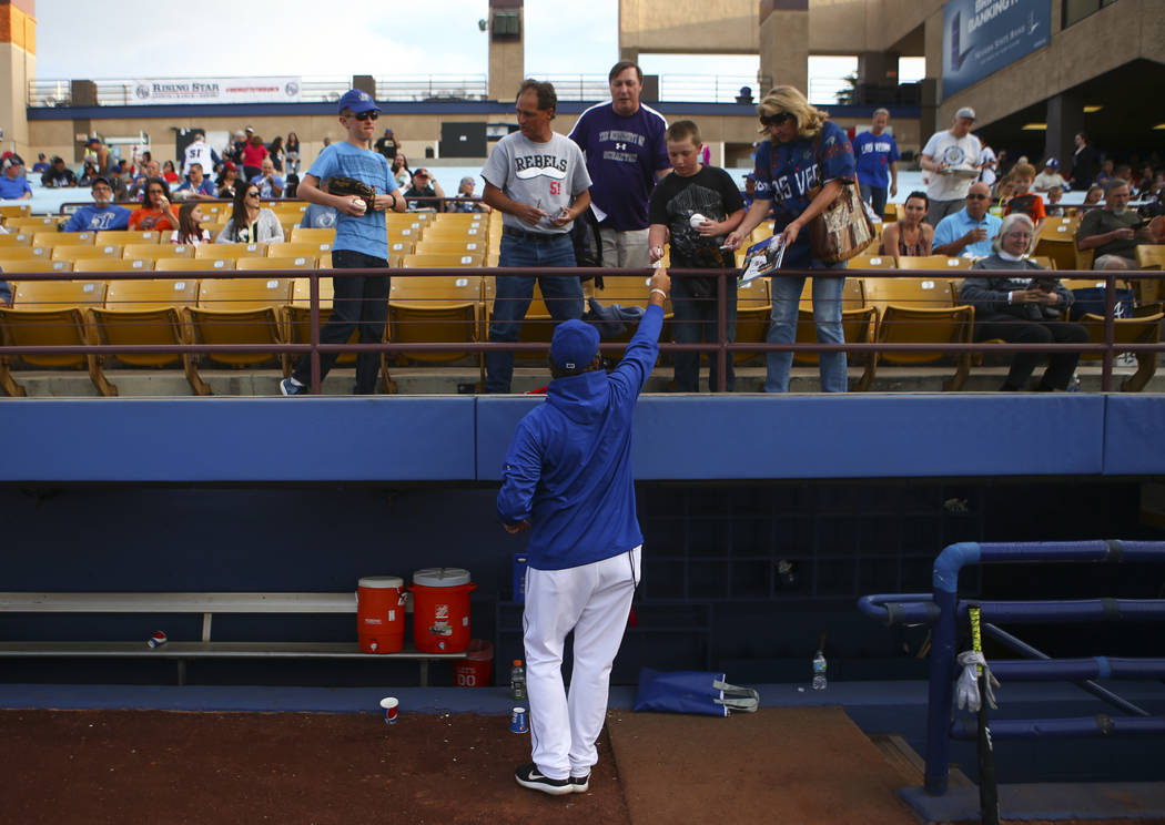 Las Vegas 51s pitching coach Frank Viola (34) signs autographs for fans before the start of the opening day game against the Fresno Grizzlies at Cashman Field in Las Vegas on Tuesday, April 11, 20 ...