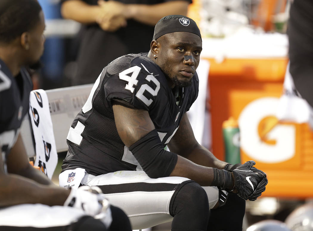Oakland Raiders safety Karl Joseph sits on the bench during the second half of an NFL preseason football game against the Tennessee Titans Saturday, Aug. 27, 2016, in Oakland, Calif. (AP Photo/Ben ...