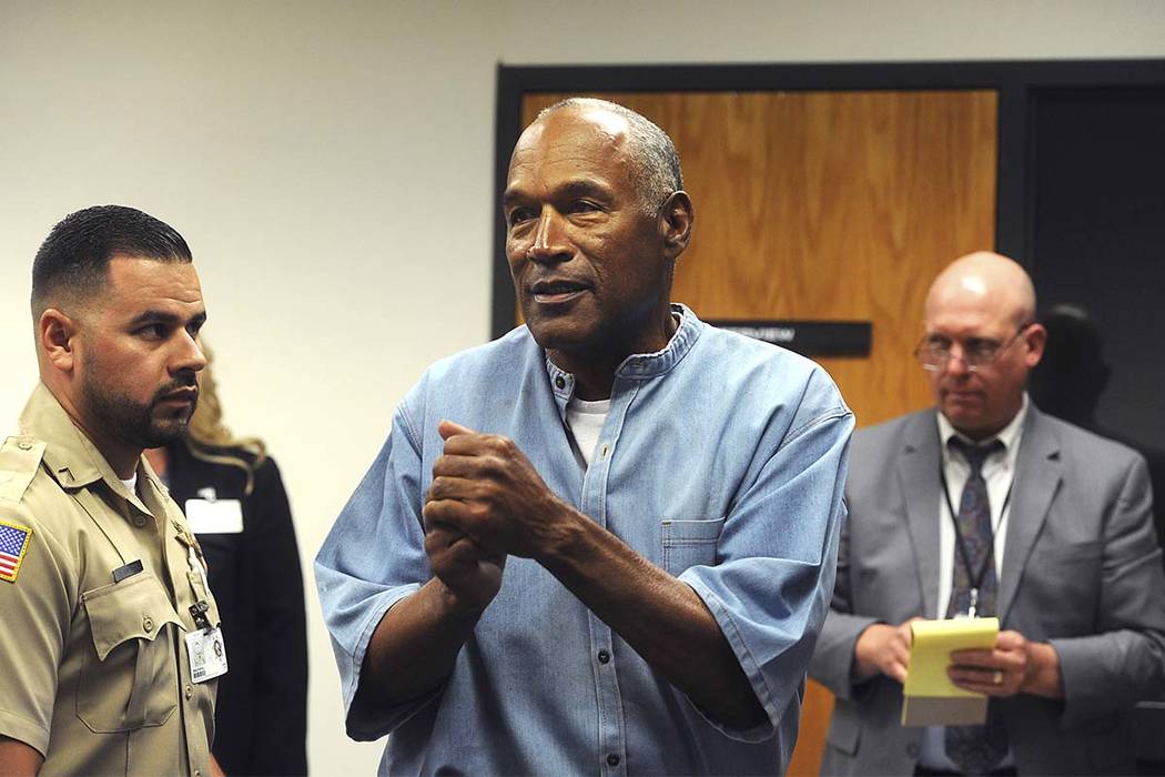 Former NFL football star O.J. Simpson reacts after learning he was granted parole at Lovelock Correctional Center in Lovelock, Nev., on Thursday, July 20, 2017.  Simpson was convicted in 2008 of e ...