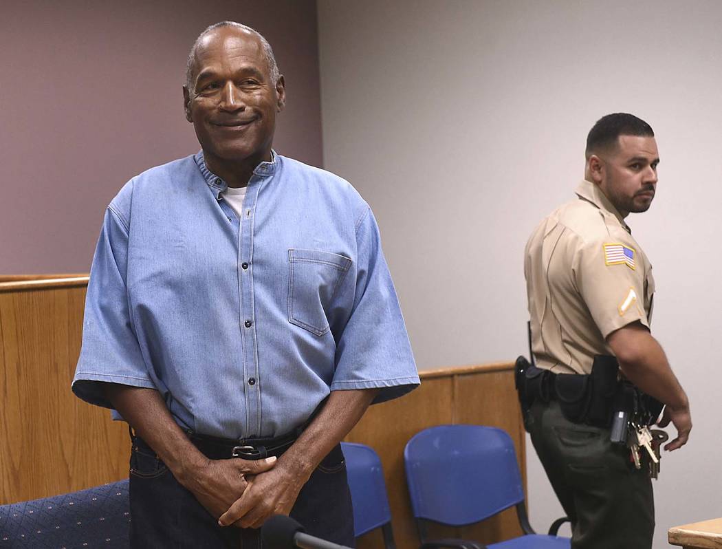 Former NFL football star O.J. Simpson enters for his parole hearing at the Lovelock Correctional Center in Lovelock, Nev., on Thursday, July 20, 2017.  Simpson was convicted in 2008 of enlisting s ...