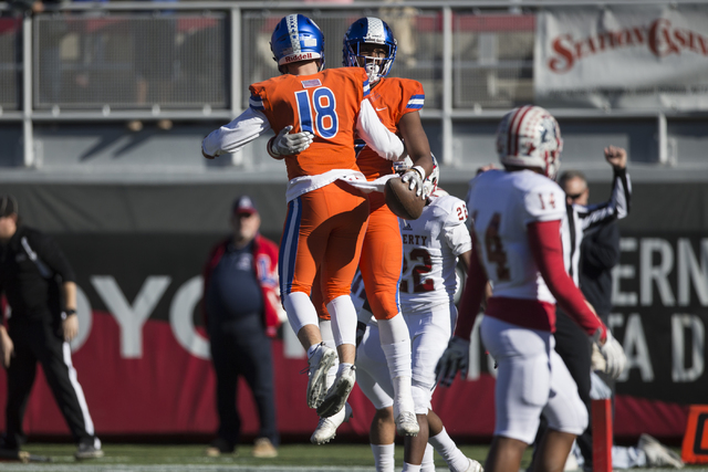 Brevin Jordan (9) celebrates his touchdown with Tate Martell (18) against Liberty in the Class 4A state football championship game at Sam Boyd Stadium on Saturday, Dec. 3, 2016, in Las Vegas. Bish ...