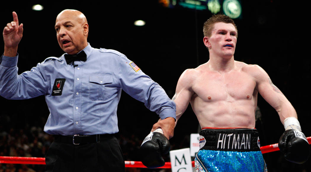 Ricky Hatton, of Great Britain, right, is penalized by referee Joe Cortez after being called for hitting Floyd Mayweather Jr. in the back of the head during their WBC welterweight boxing title fig ...