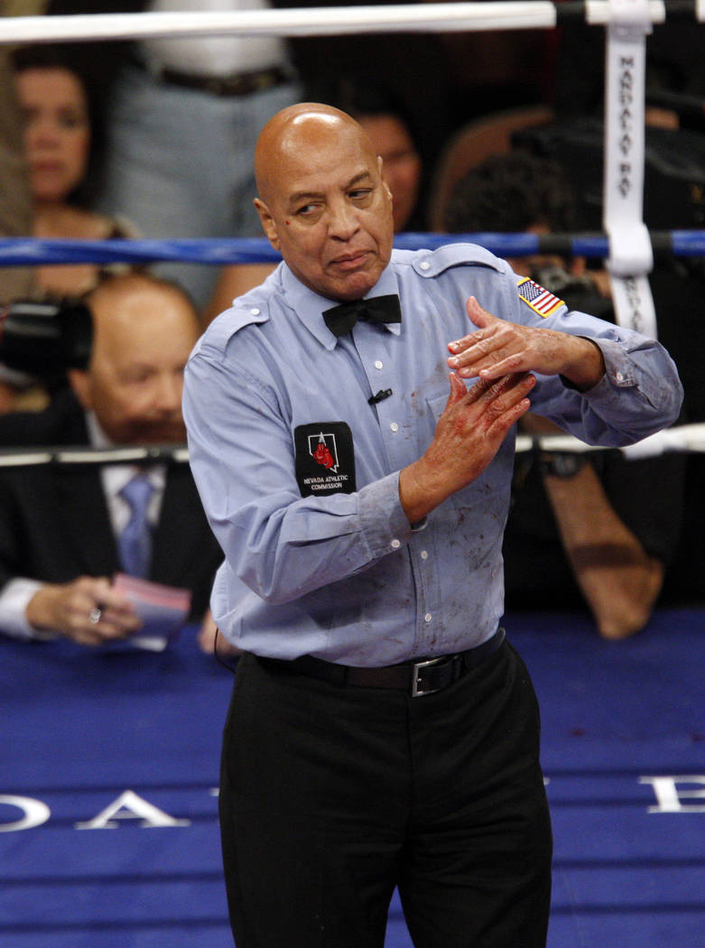 Ref Joe Cortez calls time to speak with ringside officials during the Humberto Soto - Francisco Lorenzo interim WBC super featherweight championship boxing match at Mandalay Bay hotel and Casino i ...
