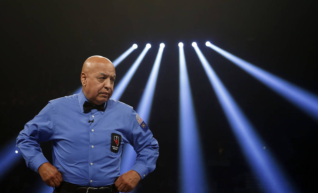 Boxing hall-of-fame referee Joe Cortez prepares to officiate his final boxing match before retiring between Canelo Alvarez, of Mexico, and Josesito Lopez on Saturday, Sept. 15, 2012, in Las Vegas. ...