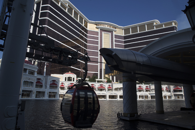 A Wynn Palace SkyCab moves along the water fountain in front of the hotel on Monday, Sept. 12, 2016, in Macau. Erik Verduzco/Las Vegas Review-Journal Follow @Erik_Verduzco