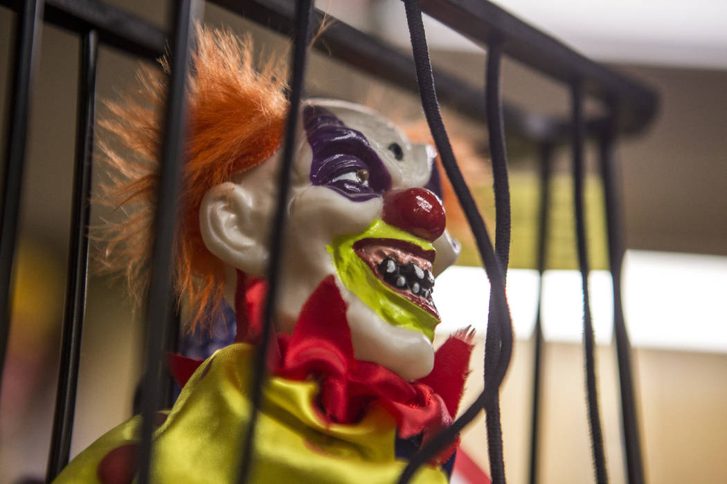 A creepy clown locked up in a cage in the lobby of the Clown Motel in Tonopah on Tuesday, July 25, 2017. The Clown is currently for sale with the condition that the new owner must keep the clown t ...