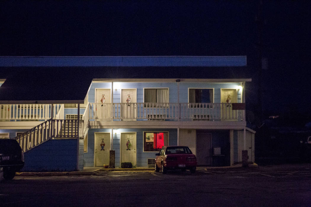 Warm lights illuminate walkways at the Clown Motel in Tonopah on Tuesday, July 25, 2017. The Clown is currently for sale with the condition that the new owner must keep the clown theme.  Patrick C ...