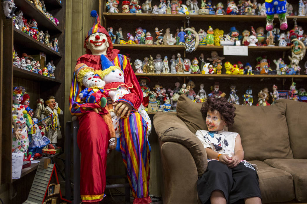 Kai James, 9, glances over at the life-size clown known as &quot;Mr. Creepy&quot; in the lobby of the Clown Motel in Tonopah on Tuesday, July 25, 2017. James came with his brother and moth ...