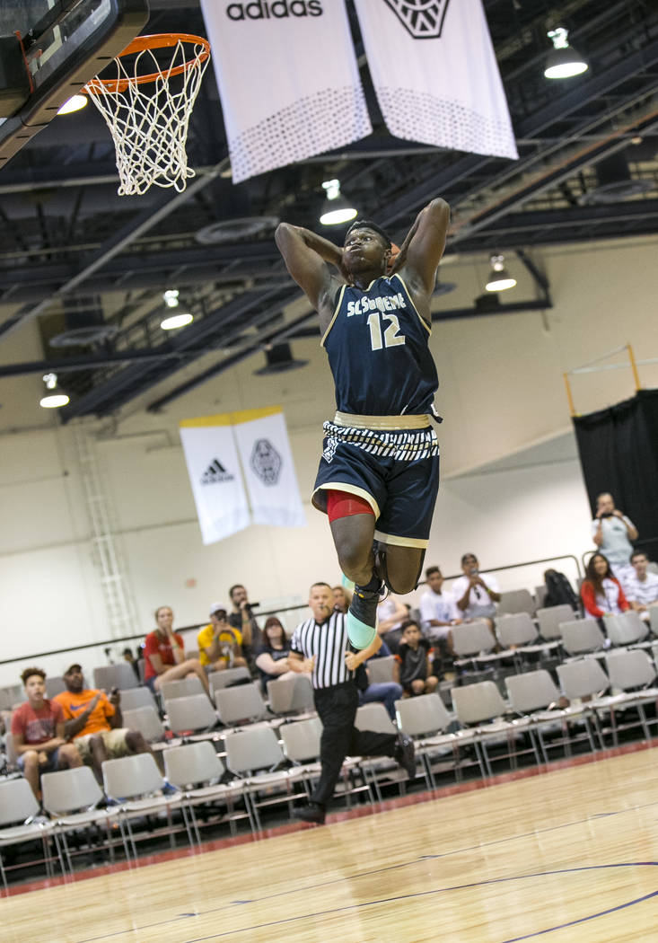 SC Supreme forward Zion Williamson (12) breaks away for a dunk against Play Hard Play Smart during an Adidas Uprising Summer Championship basketball game at Cashman Center, Friday, July 28, 2017,  ...