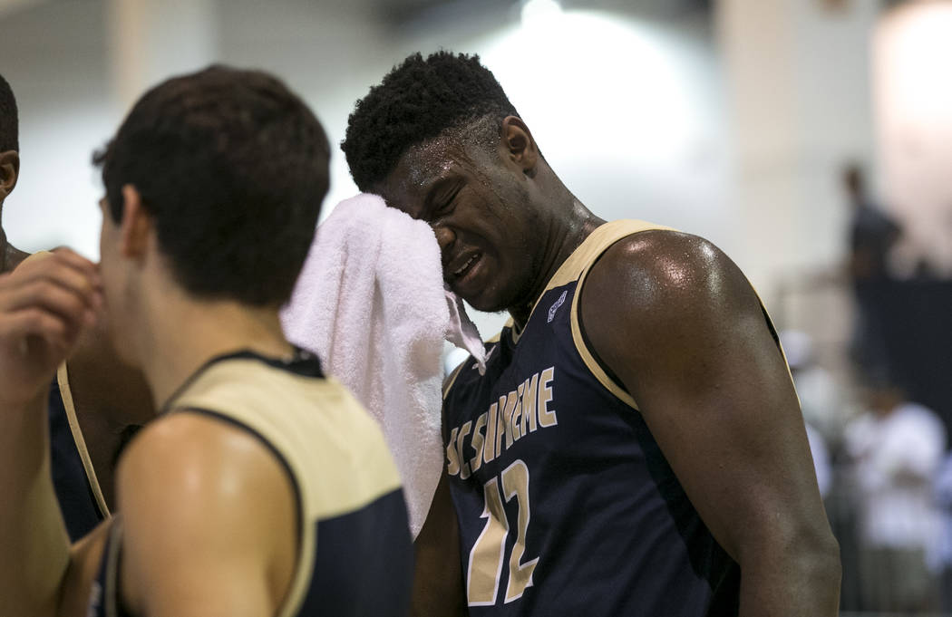 SC Supreme forward Zion Williamson (12) wipes his brow on a time out against Play Hard Play Smart during an Adidas Uprising Summer Championship basketball game at Cashman Center, Friday, July 28,  ...