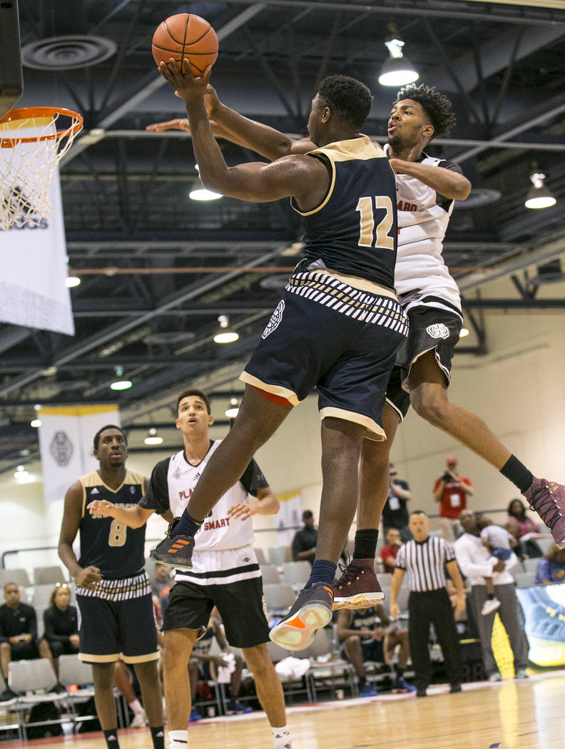 SC Supreme forward Zion Williamson (12) takes a shot over Play Hard Play Smart's Jordan Brown (21) during an Adidas Uprising Summer Championship basketball game at Cashman Center, Friday, July 28, ...