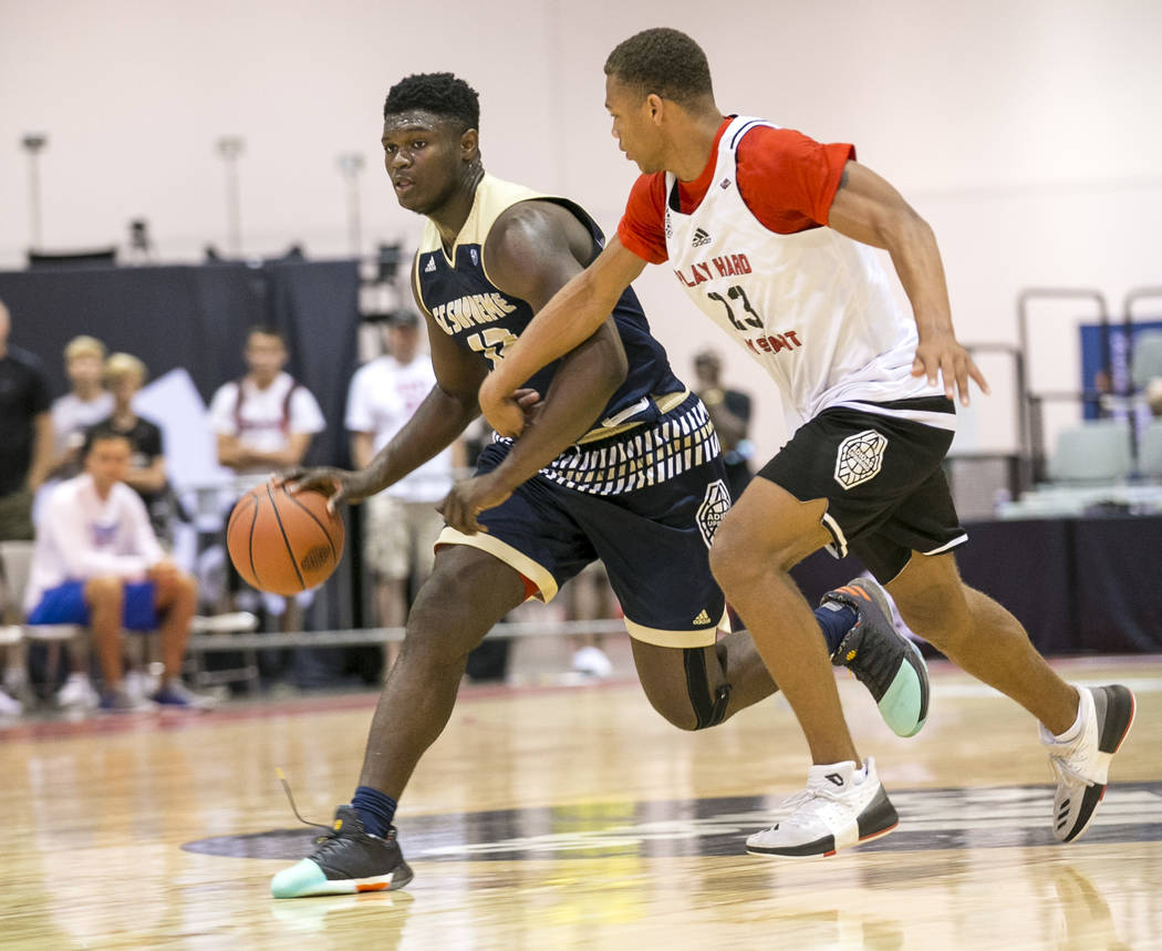 SC Supreme forward Zion Williamson (12) drives the ball by Play Hard Play Smart's Christopher Gray (23) during an Adidas Uprising Summer Championship basketball game at Cashman Center, Friday, Jul ...