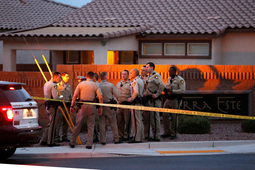 Police officers investigate an officer-involved shooting on North Goldfield Street in North Las Vegas, Monday, July 24, 2017. According to police, two people were shot and taken to local hospitals ...