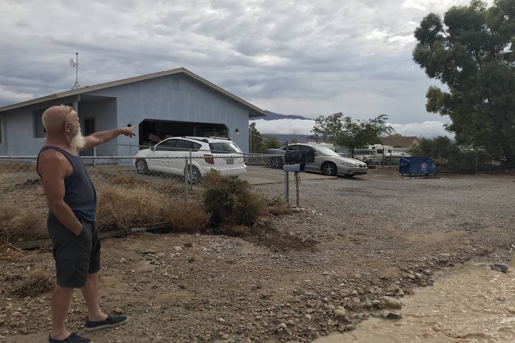 At Joe Nieznanski's mother's home in northwest Las Vegas, the floods washed away gravel at the edge of her driveway Tuesday morning, creating a three-foot-deep pothole. (Jessie Bekker/Las Vegas Re ...