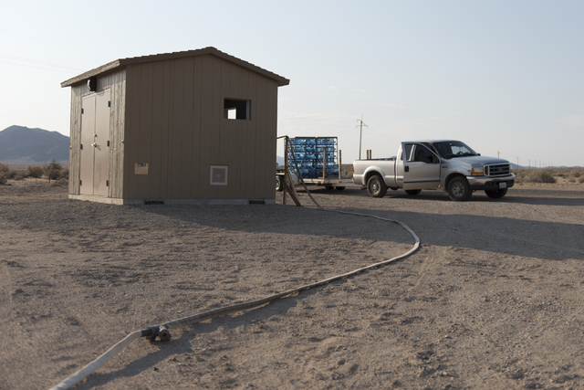 A truck hauling jugs of potable water sits next to the shed for a clean water vending machine in Tecopa, Calif., on June 21, 2016. Las Vegas Review-Journal file