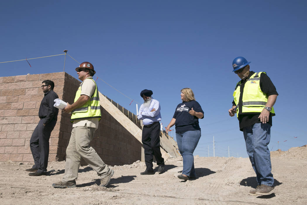 Akashi Bhatti (left), Construction Superintendent Mike Stephenson (left center), Bill Bhatti (center), Sherri Weaver (center right) of the Nevada State Bank and Construction Superintendent Bruce K ...