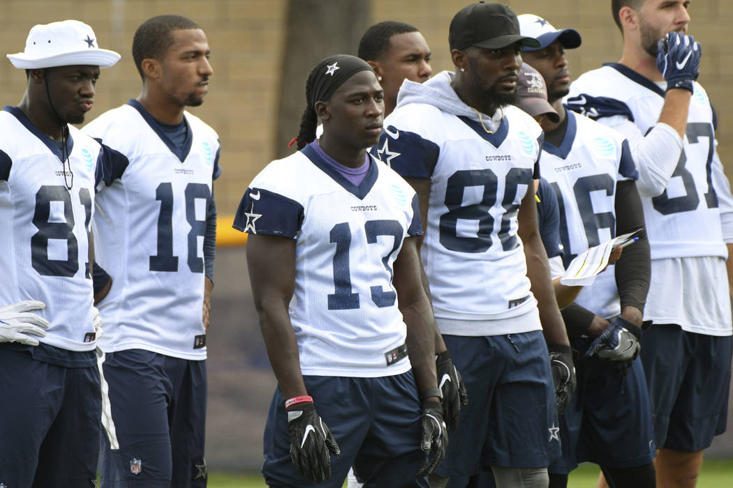 Dallas Cowboys wide receiver Lucky Whitehead (13) stands with fellow receivers during practice at the NFL football team's training camp in Oxnard, Calif., Monday, July 24, 2017. (AP Photo/Michael  ...