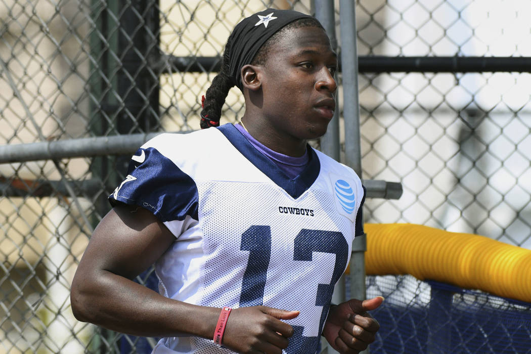 Dallas Cowboys wide receiver Lucky Whitehead (13) runs onto the field for practice at the NFL team's football training camp in Oxnard, Calif., Monday, July 24, 2017. (AP Photo/Michael Owen Baker)