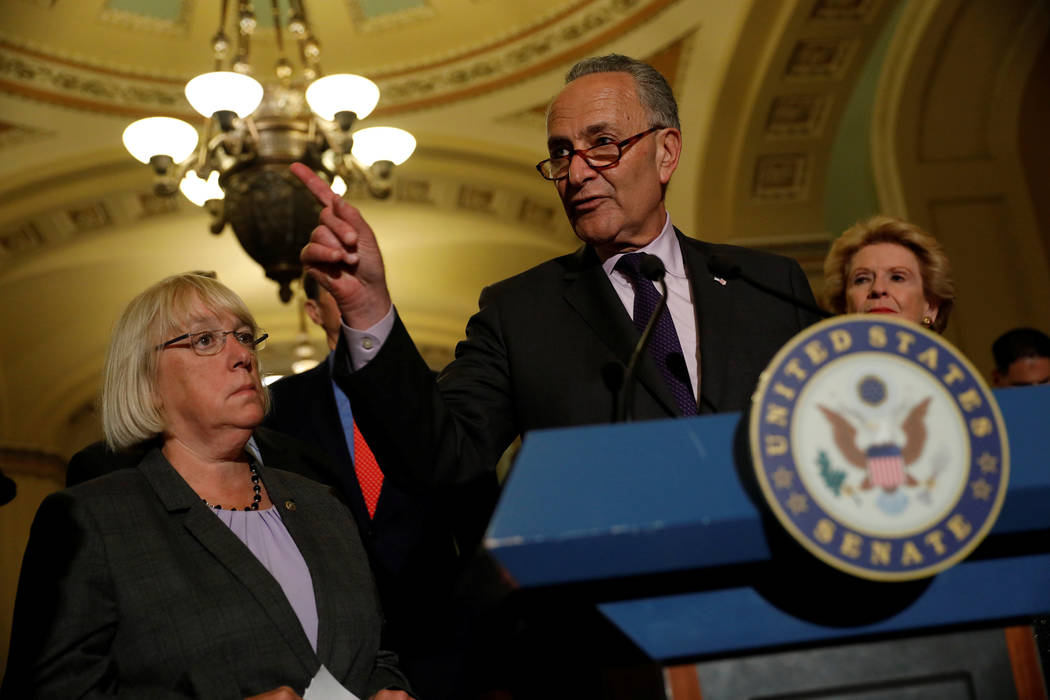 Senate Minority Leader Chuck Schumer, accompanied by Senator Patty Murray (D-WA) and Senator Debbie Stabenow (D-MI), speaks with reporters following the successful vote to open debate on a health  ...