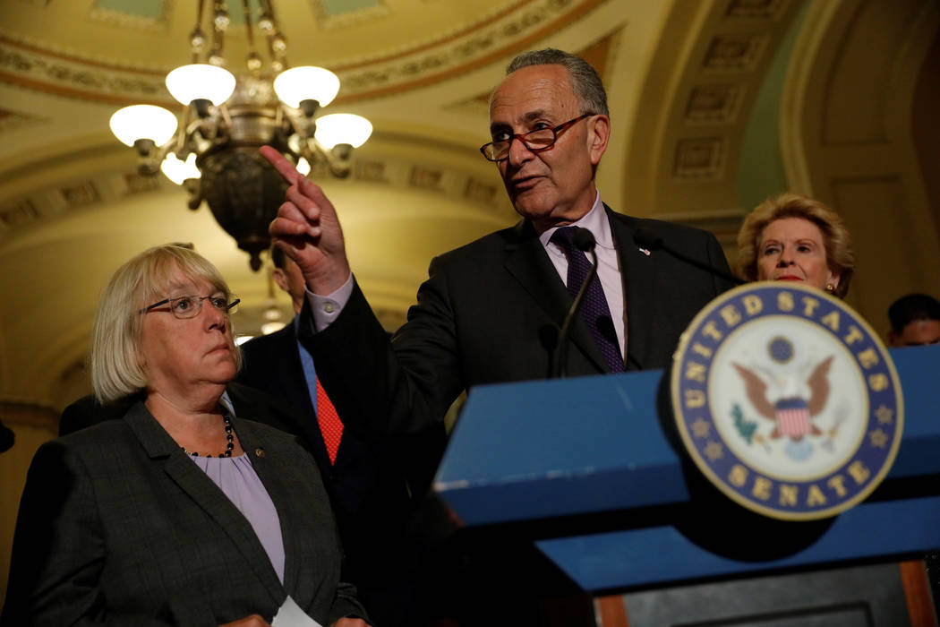 Senate Minority Leader Chuck Schumer, accompanied by Senator Patty Murray (D-WA) and Senator Debbie Stabenow (D-MI), speaks with reporters following the successful vote to open debate on a health ...