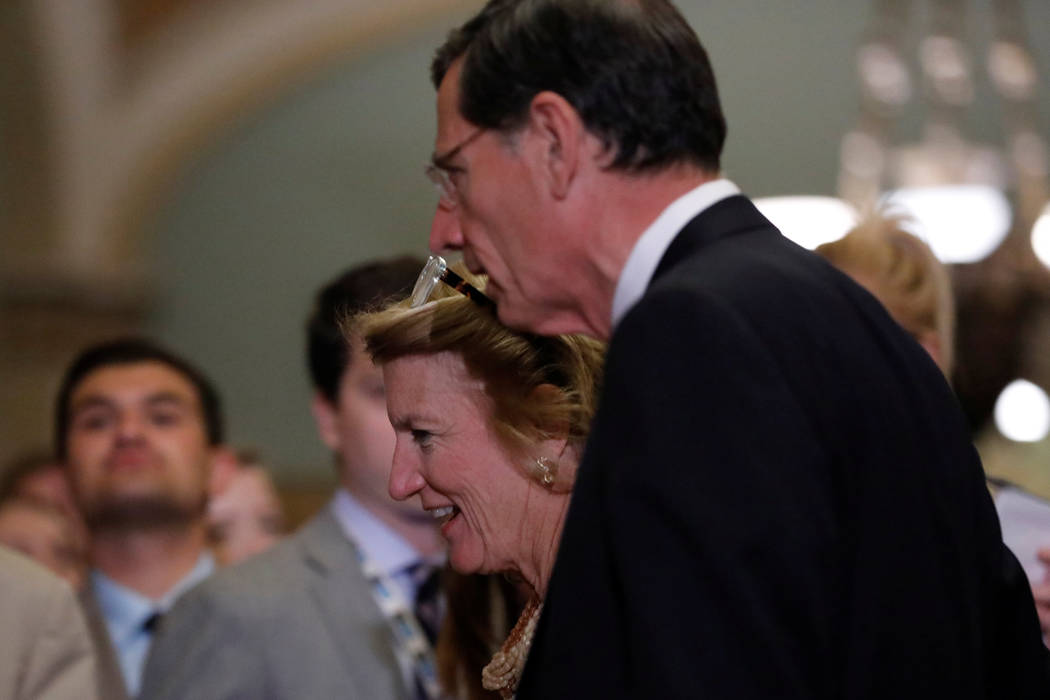 Sens. Shelley Moore Capito, R-WVa, and John Barrasso, R-Wyo., walk to the Senate sloor to vote on the health care bill on Capitol Hill in Washington, July 25, 2017. (Aaron P. Bernstein/Reuters)