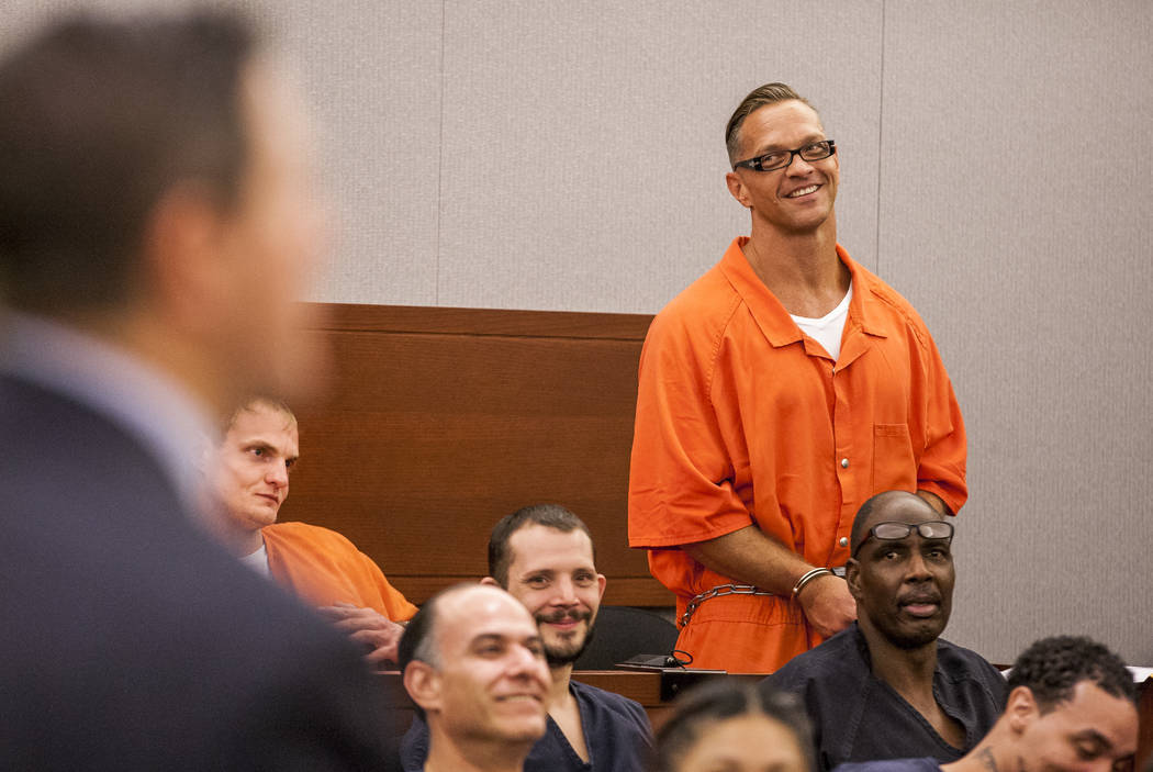 Two-time killer Scott Dozier smiles after cracking a joke during his hearing at the Regional Justice Center on Thursday, July 27, 2017. Dozier was advised by his attorney and others to seek an app ...