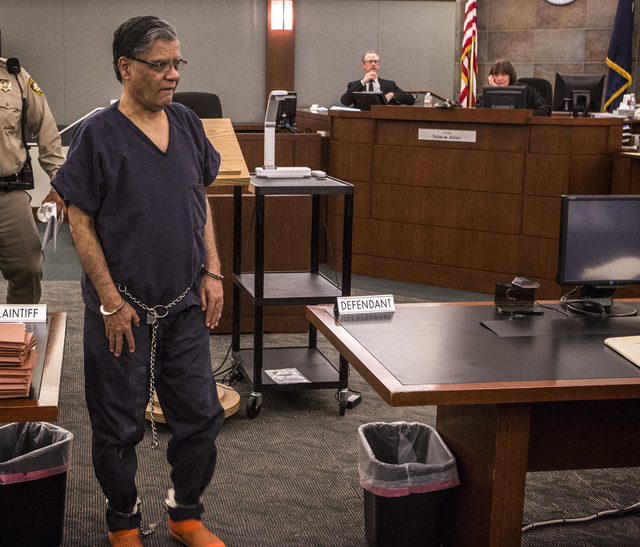A shackled Dr. Dipak Desai is escorted out of court after District Judge Valerie Adair sentenced him Thursday, Oct. 24, 2013 at Regional Justice Center. (Jeff Scheid/Las Vegas Review-Journal)