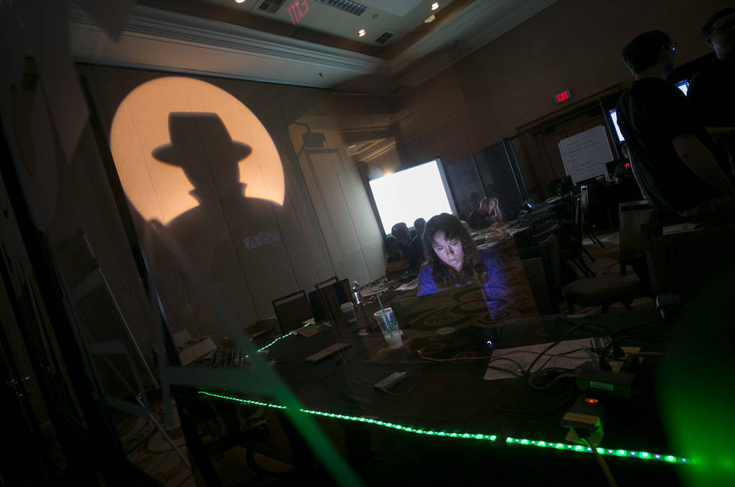 A Black Hat tech associate works in the network operating center (NOC) during the Black Hat information security conference at Mandalay Bay, Wednesday, July 26, 2017, In Las Vegas. Richard Brian L ...
