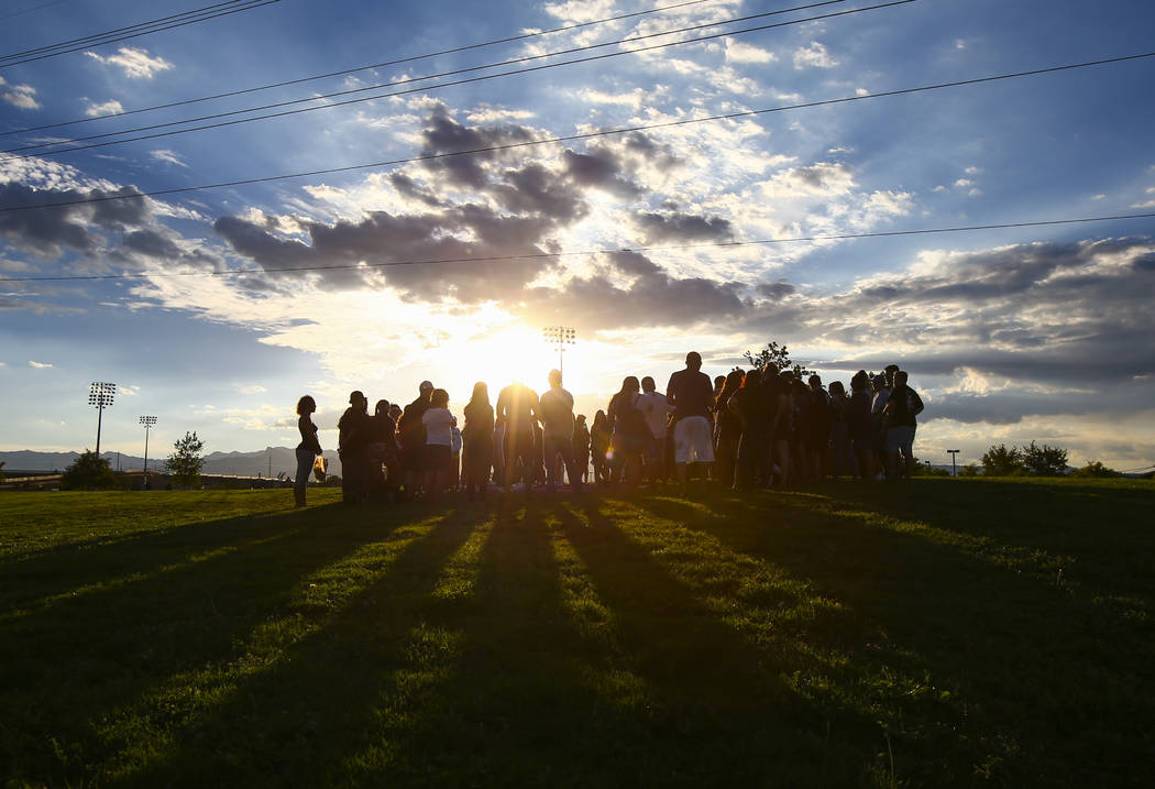 People gather during a vigil for Haylei Hughes, a former Cimarron-Memorial student-athlete, who died in a hiking accident in Wash., at Kellogg Zaher Sports Complex in Las Vegas on Thursday, July 2 ...