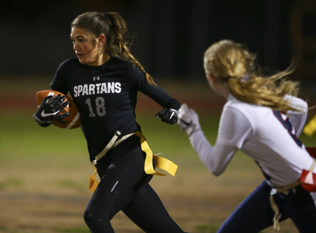 Cimarron-Memorial's Haylei Hughes (18) runs the ball against Coronado during the Class 4A state championship flag football game at Cimarron-Memorial High School in Henderson on Wednesday, Feb. 22, ...