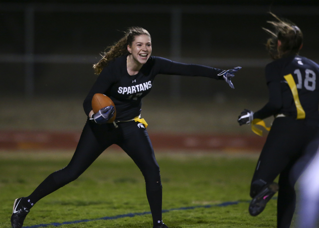 Cimarron-Memorial's Alyssa Karpinski (17) celebrates with Cimarron-Memorial's Haylie Hughes (18) after scoring a touchdown against Coronado during the Class 4A state championship flag football gam ...